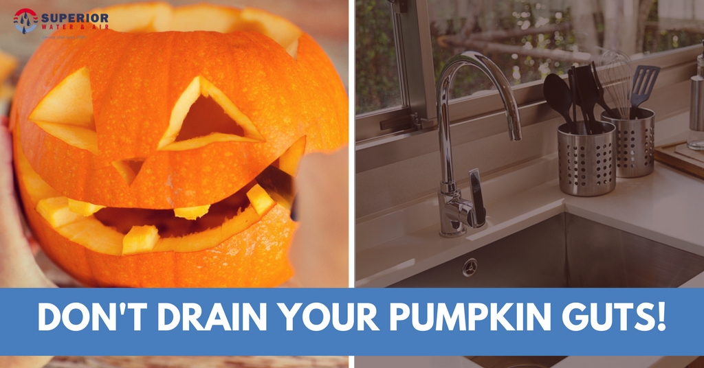 A carved pumpkin and a clean kitchen sink side-by-side.