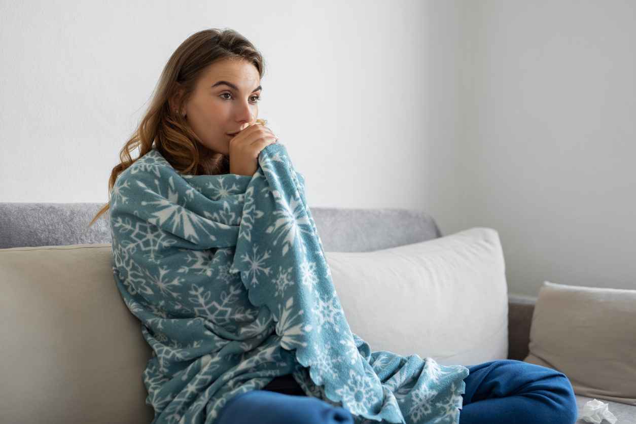 Woman freezing at home